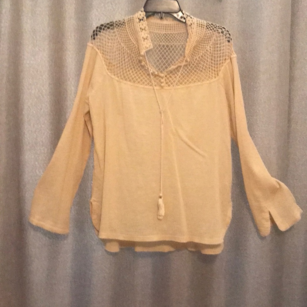 Gold shirt.